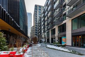a street in a city with tall buildings at Mennica Residence - City Center by Renters Prestige in Warsaw