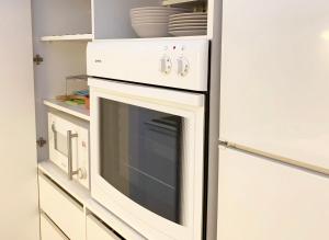 Η κουζίνα ή μικρή κουζίνα στο Miu Arena Apartment