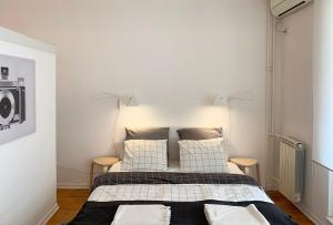 Ένα ή περισσότερα κρεβάτια σε δωμάτιο στο Miu Arena Apartment