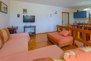 a living room with two couches and a tv at JELICIC C in Crikvenica