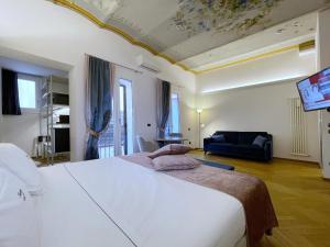 Postel nebo postele na pokoji v ubytování Hotel Touring + 37 fotografií