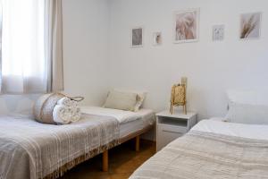 Ένα ή περισσότερα κρεβάτια σε δωμάτιο στο Bellavista Apartment 1C - Direkter Strandzugang
