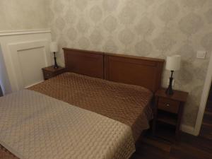 Posteľ alebo postele v izbe v ubytovaní Zoé Apartman