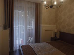 Posteľ alebo postele v izbe v ubytovaní Zoé Apartman