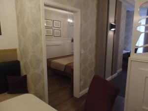 Posteľ alebo postele v izbe v ubytovaní Zoé Apartman