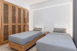A bed or beds in a room at Villa Calma