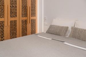 A bed or beds in a room at Villa Calma