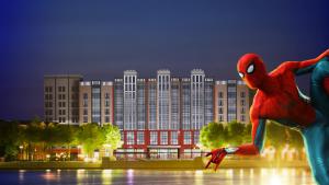 a spider man statue in front of a large building at Disney Hotel New York - The Art of Marvel in Chessy