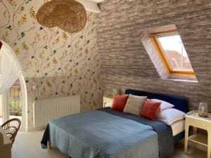 Postel nebo postele na pokoji v ubytování Levendula Apartman