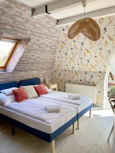 Postel nebo postele na pokoji v ubytování Levendula Apartman