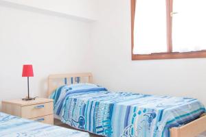A bed or beds in a room at Ultrapanoramica a Costa Paradiso