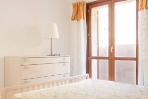 A bed or beds in a room at Ultrapanoramica a Costa Paradiso