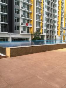 a walkway in front of some apartment buildings at Sv Mathrew studios in Nilai