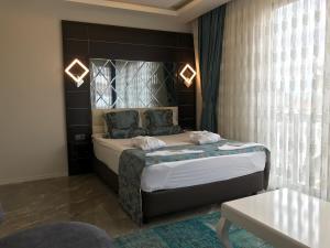 Postel nebo postele na pokoji v ubytování Venus Hotel + 37 fotografií