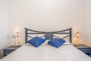 Łóżko lub łóżka w pokoju w obiekcie Apartamentos Hipocampos Unitursa