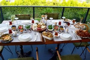 a table with plates of food on top at PAYAM BUTİK OTEL in Datca