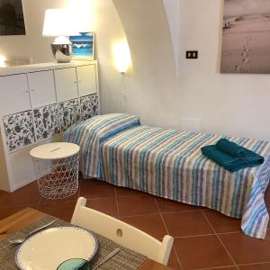 A bed or beds in a room at La Casetta nel Borgo