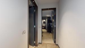 a hallway with a door to a room with at GALLERIA The Smart Boutique APARTHOTEL By OSPITAMI in Milan