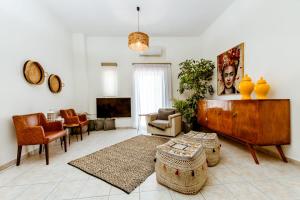 A television and/or entertainment centre at Chania Paradise Retreat - Falasarna Villa Nostalgia