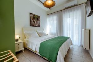 A bed or beds in a room at Chania Paradise Retreat - Falasarna Villa Nostalgia