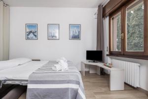 A bed or beds in a room at Appartamento Fiocco