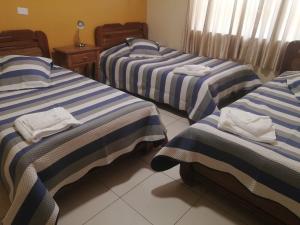 En eller flere senge i et værelse på Mitru Express Tupiza