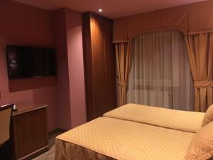 TV a/nebo společenská místnost v ubytování Hotel Torres I