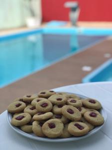 a plate of cookies sitting on a table at Hotel Pousada Mar Azul in Itapoa