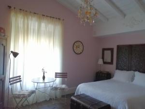 Postel nebo postele na pokoji v ubytování Casona Del Duende