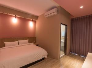 Postel nebo postele na pokoji v ubytování Yujing B&B 2 + 15 fotografií