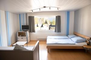 מיטה או מיטות בחדר ב-Beachhouse Isleten