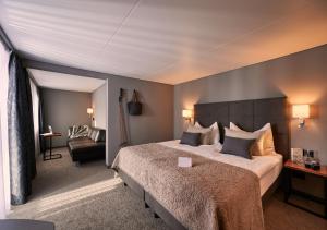 A bed or beds in a room at Hotel Ambiance Superior