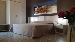 A bed or beds in a room at Terrazze Villanova
