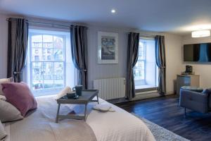 a living room with a couch and a table at The Three Crowns B&B in Plymouth