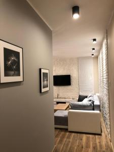 Telewizja i/lub zestaw kina domowego w obiekcie Gdansk Apartament Harmonia Oliwska