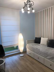 Łóżko lub łóżka w pokoju w obiekcie Gdansk Apartament Harmonia Oliwska