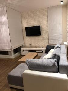 Telewizja i/lub zestaw kina domowego w obiekcie Gdansk Apartament Harmonia Oliwska
