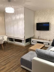 Telewizja i/lub zestaw kina domowego w obiekcie Gdansk Apartament Harmonia Oliwska