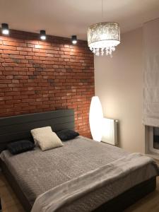 Łóżko lub łóżka w pokoju w obiekcie Gdansk Apartament Harmonia Oliwska