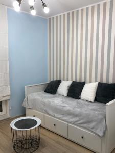 Łóżko lub łóżka w pokoju w obiekcie Gdansk Apartament Harmonia Oliwska