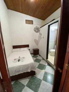 Postel nebo postele na pokoji v ubytování Hotel Policarpa