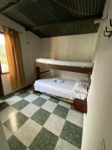 Postel nebo postele na pokoji v ubytování Hotel Policarpa