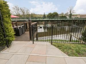 a gate on a wooden walkway with a bridge at Eskview Cottage in Whitby +14 photos