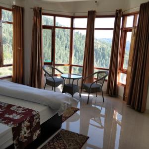 Voodi või voodid majutusasutuse Pranav Homes - An idyllic abode with a picturesque view toas