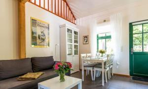 a living room with a couch and a table at Alte Tischlerei 01 in Wustrow