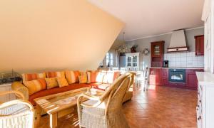 a living room with a couch and a table at Madlen in Ahrenshoop