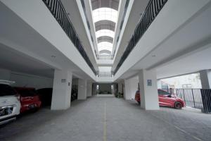 a large parking garage with cars parked in it at DPARAGON SUMBER in Solo