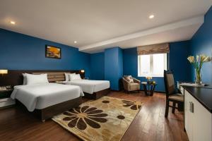 Ένα ή περισσότερα κρεβάτια σε δωμάτιο στο Hanoi 20 Hotel & Apartment