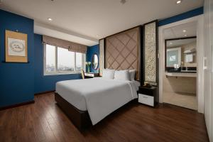 Ένα ή περισσότερα κρεβάτια σε δωμάτιο στο Hanoi 20 Hotel & Apartment