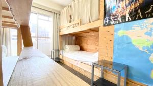 Postel nebo postele na pokoji v ubytování GUEST HOUSE B's FiveⅡ